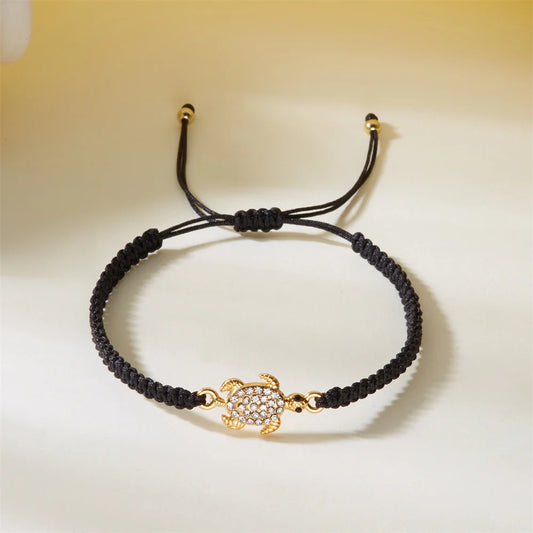 Women’s Adjustable Sea Turtle Bracelet – Gold Color, Rhinestones, Hand-Knitted Rope Chain | Summer Gifts - Floq & Raman
