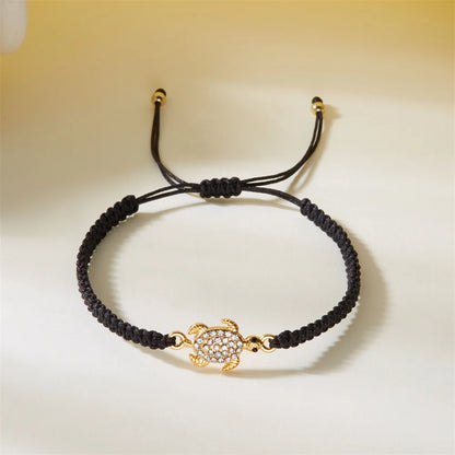 Women’s Adjustable Sea Turtle Bracelet – Gold Color, Rhinestones, Hand-Knitted Rope Chain | Summer Gifts - Floq & Raman